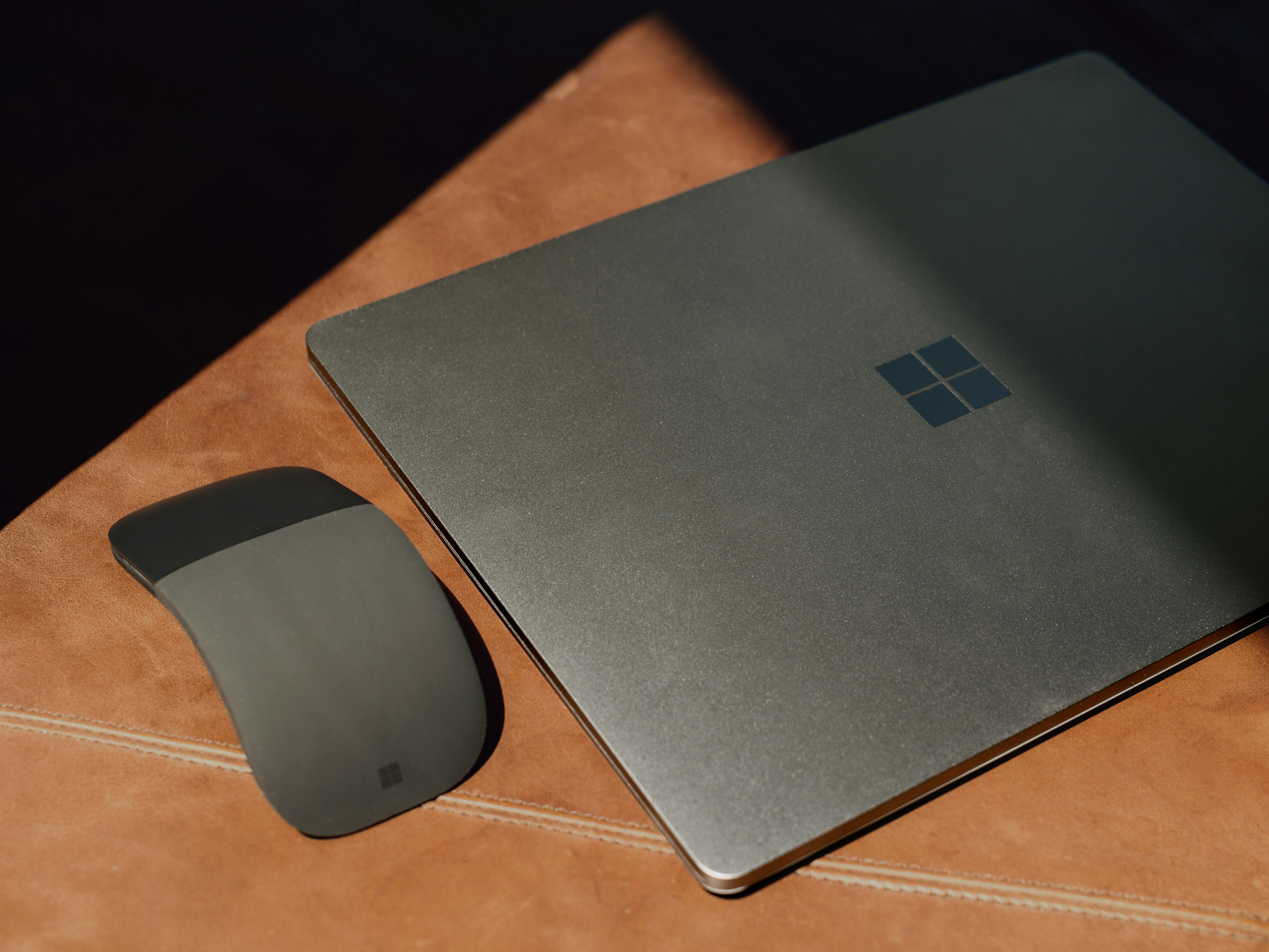 Surface and mouse on brown wooden table